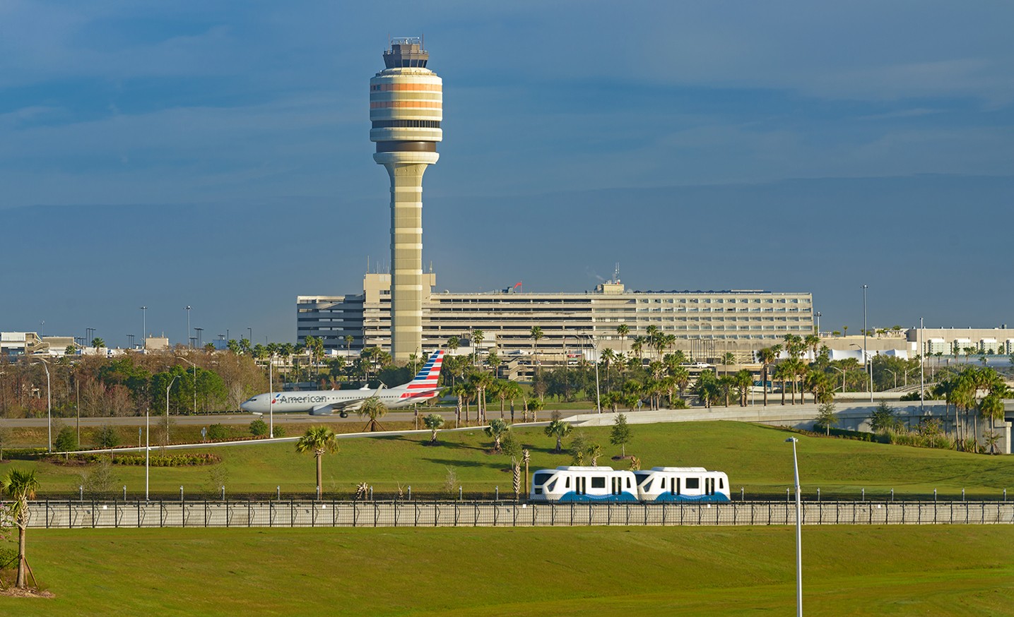 North Terminal with ATC Tower, APM and Aircraft Hero Image